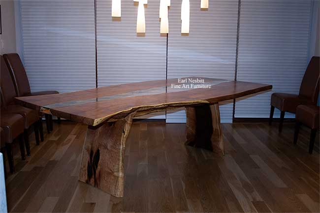 wood slab dining table installed showing partial trestle style base